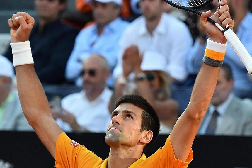 Novak Djokovic of Serbia celebrates after beating Swiss Roger Federer in their final match for the Italian Open tennis tournament at the Foro Italico in Rome on Sunday. -- PHOTO: EPA