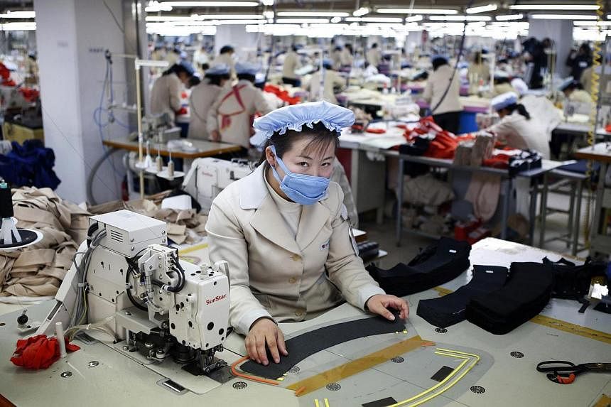 A North Korean employee works in a factory of a South Korean company at the Joint Industrial Park in Kaesong industrial zone on Dec 19, 2013. United Nations Secretary-General Ban Ki Moon has announced he will pay a visit to the the Kaesong Industrial