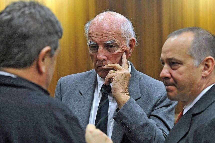 Former Grand Slam doubles tennis champion Bob Hewitt (centre) looks on during his sentencing at a high court in Pretoria, May 18, 2015. -- PHOTO: REUTERS&nbsp;