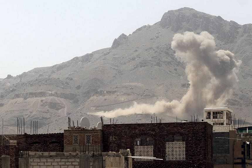 Smoke billows from Noqum Mountain after it was hit by an air strike in Yemen's capital Sana'a on May 19, 2015. -- PHOTO: REUTERS