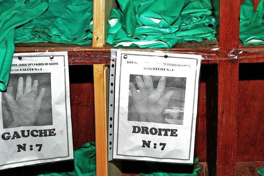 Protective gloves are pictured at the Donka Ebola treatment center on May 2, 2015 in Conakry, Guinea. &nbsp;Ebola has spread further in Guinea and Sierra Leone, with 36 cases in the past week, four times as many cases as the week before, the World He