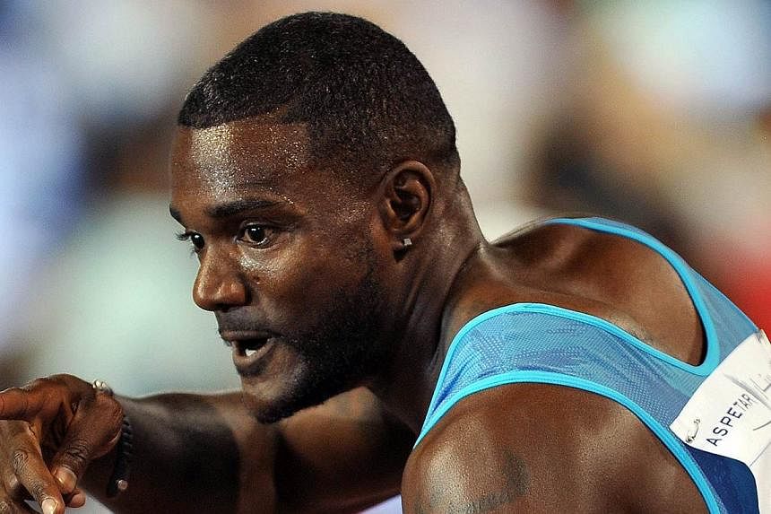 Justin Gatlin of the USA celebrates after winning the men's 100 meters during the IAAF Diamomd League Meeting in Doha, Qatar, on May 15, 2015. The controversial sprinter ran into a new row on Tuesday, May 19, when he flew home on the eve of the Beiji