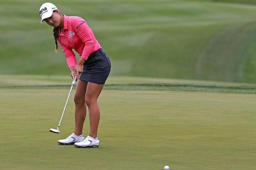 Minjee Lee of Australia putts for birdie on the 18th hole during the continuation of final round of the Kingsmill Championship presented by JTBC on the River Course at Kingsmill Resort on Monday in Williamsburg, Virginia in the US. -- PHOTO: AFP