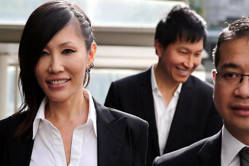 Pop singer Sun Ho (left) arriving at the State Courts on May 19, 2015, with her husband Kong Hee (centre), founder of City Harvest Church, and Senior Counsel Edwin Tong. -- PHOTO: WONG KWAI CHOW