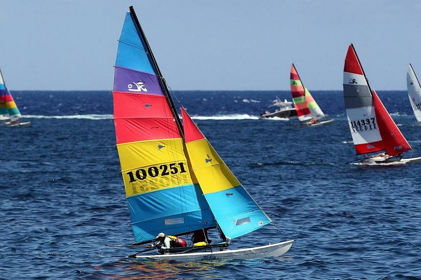 Catamarans from the US and Cuba competing in a regatta at the Malecon in Havana on May 19, 2015. It is the first regatta since the two countries' decision to seek normal ties after more than five decades of Cold War strains. -- PHOTO: EPA