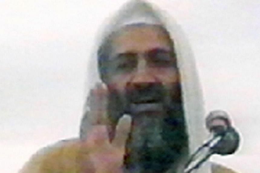 This undated image grab shows Osama bin Laden speaking at an undisclosed location in Afghanistan from a video said to have been prepared by bin Laden himself. -- PHOTO: AFP