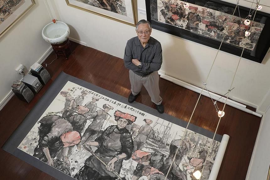 Watercolourist Tong Chin Sye with Toiling For Our Loved Ones, his largest work at the exhibition.
