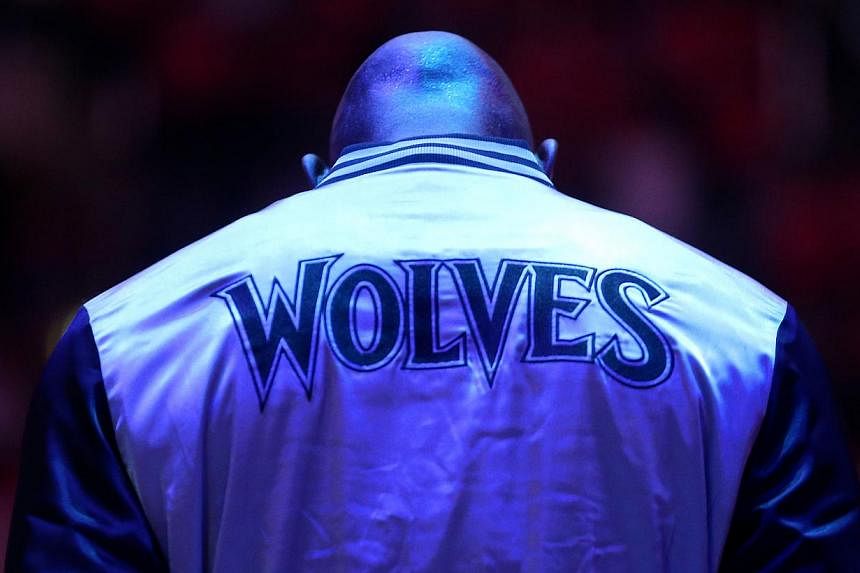 Kevin Garnett #21 of the Minnesota Timberwolves stands during the singing of the national anthem before the game with the Los Angeles Clippers at Staples Center on March 9, 2015 in Los Angeles, California. The Timberwolves won the right to pick first