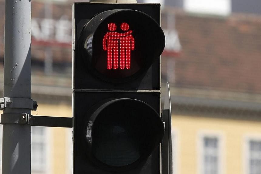 A new traffic light, showing a same-sex couple, is pictured on May 12, 2015 in Vienna.&nbsp;Gay-themed traffic lights installed in Vienna for the 2015 Eurovision Song Contest have proven so popular that authorities have now decided to keep them for g