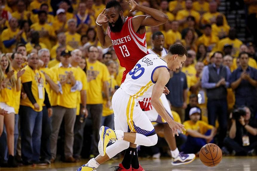 Stephen Curry #30 of the Golden State Warriors drives against James Harden #13 of the Houston Rockets in the first half during Game One of the Western Conference Finals of the 2015 NBA Playoffs at ORACLE Arena on May 19, 2015 in Oakland, California.-