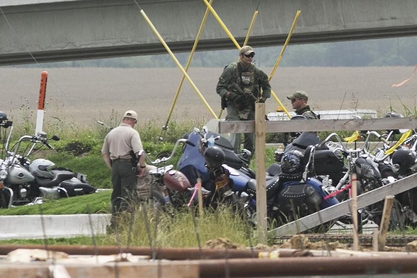 Waco Police investigators at the scene of shooting at the Twin Peaks Restaurant in Waco, Texas, May 18, 2015.&nbsp;A deadly biker brawl in Waco, Texas apparently was set off when a motorcycle gang showed up uninvited at a gathering of rival biker gro