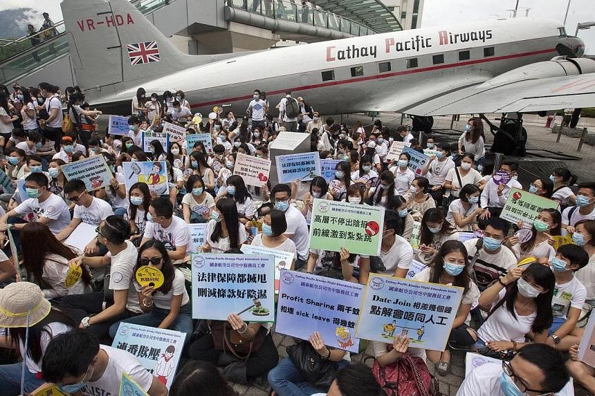 Flight attendants from Hong Kong's flag carrier airline Cathay Pacific stage a pay protest outside Cathay Pacific's management headquarters at Cathay City, Lantau Island, Hong Kong, China on&nbsp;May 21,&nbsp;2015. The Cathay Pacific Airways flight a