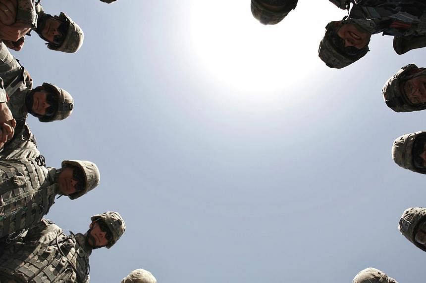 US soldiers forming a circle to pray before leaving for a monitoring mission in Baghdad in 2007. The decision to go to war in Iraq was a clear misjudgment.