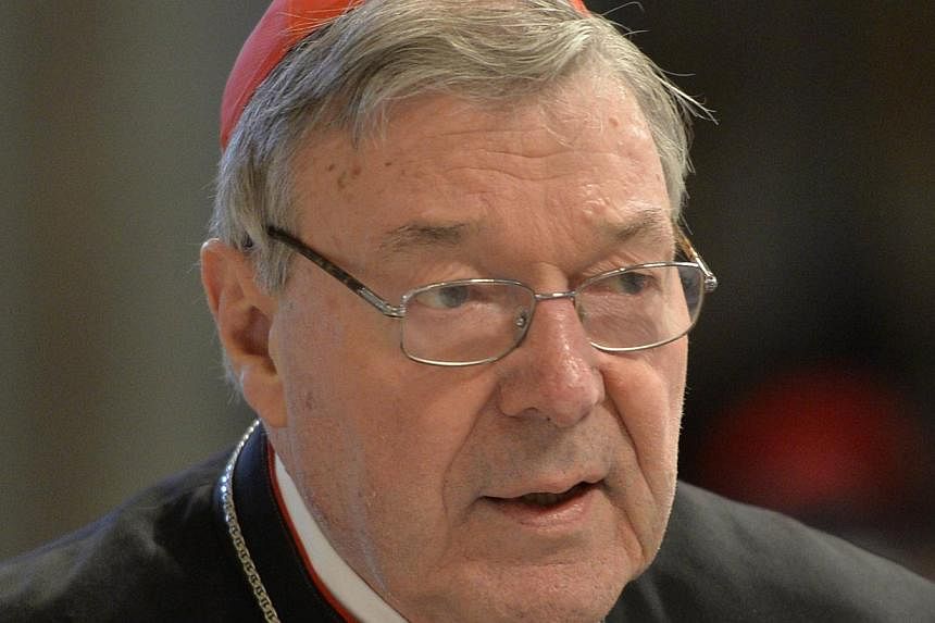 Australia's former top Catholic cleric George Pell (above), now Pope Francis' finance chief, has denied trying to bribe a victim of a paedophile priest to keep quiet as an inquiry heard of horrifying abuse. -- PHOTO: AFP