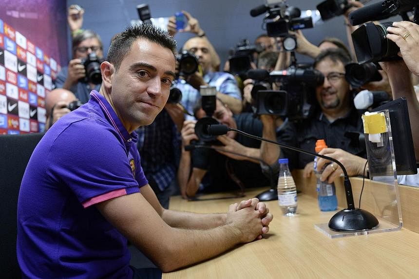Barcelona legend Xavi Hernandez confirmed on Thursday that he will end his 17-year playing career with the Catalans at the end of the season to join Qatari side Al Sadd. -- PHOTO: AFP&nbsp;