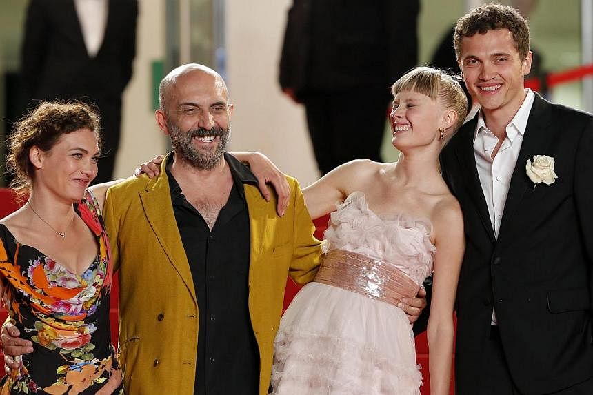 Swiss actress Aomi Muyock, Argentine director Gaspar Noe, Danish actress Klara Kristin and US actor Karl Glusman arrive for the screening of Love at Cannes on May 20, 2015. Noe rejected the idea on Thursday that his ultra-graphic 3D sex film Love was