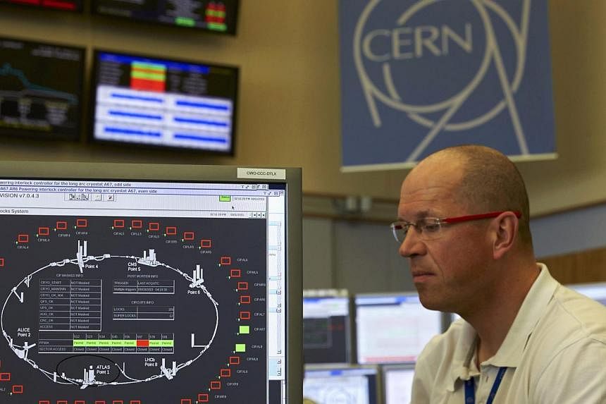 A technician works in the Control Centre of the Large Hadron Collider (LHC) at the European Organisation for Nuclear Research (Cern) in Prevessin near Geneva on March 11, 2015.&nbsp;TheLHC broke the record for energy levels late on Wednesday, May 20,