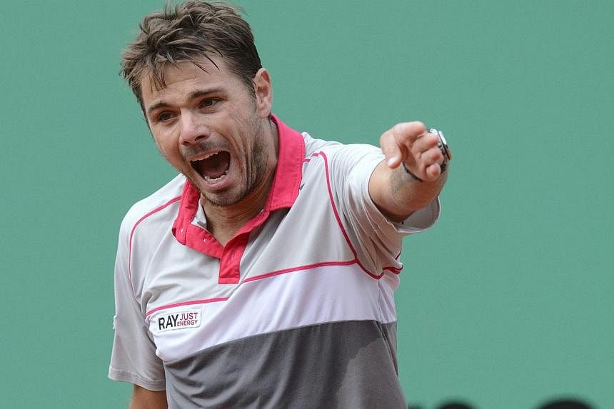 Switzerland's Stan Wawrinka reacts after losing a point to Lukas Rosol of the Czech Republic in the Geneva Open on May 20, 2015. -- PHOTO: EPA