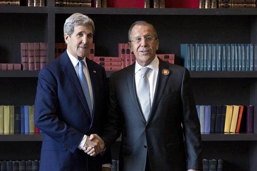 US Secretary of State John Kerry (left) shakes hands with Russian Foreign Secretary Sergei Lavrov before a bilateral meeting in Sochi, Russia May 12, 2015. Russian Foreign Minister Sergei Lavrov discussed the situation in Syria and Yemen as well as U