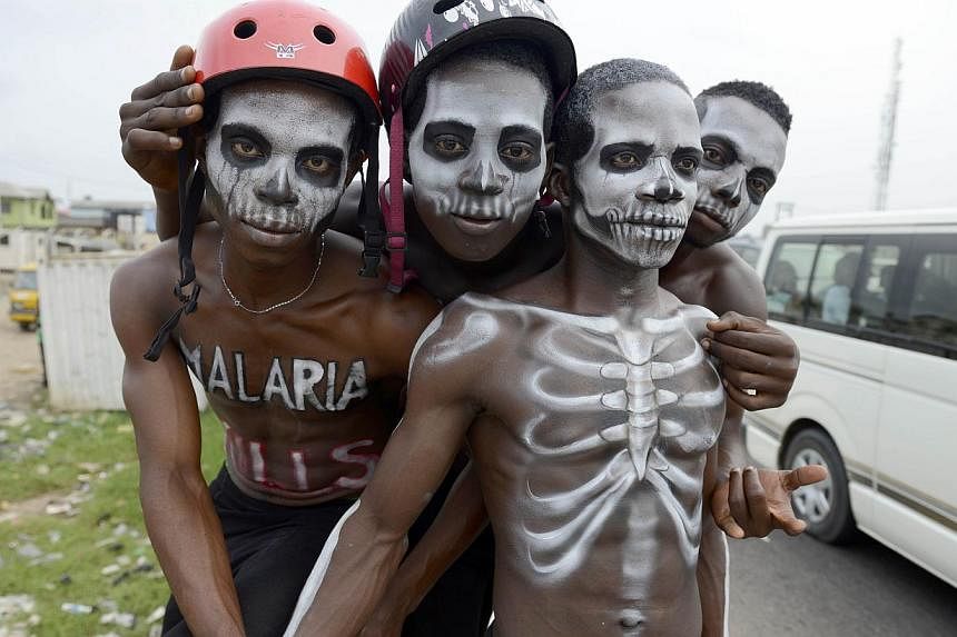 Men painted like skeleton pose on April 24, 2015, in Lagos to warn on the deadly disease prior to the World Malaria Day on April 25.&nbsp;Countries have agreed to rid the world of malaria almost completely over the next 15 years, the World Health Org
