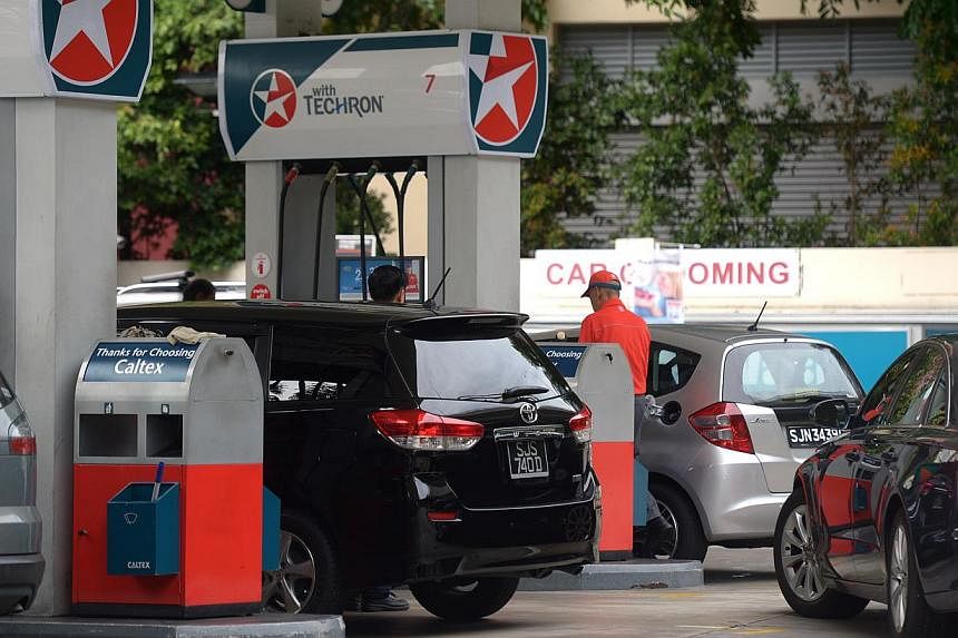 Pump prices have increased twice this month, with motorists now having to fork out up to six cents more a litre for their petrol. -- ST PHOTO:&nbsp;JAMIE KOH