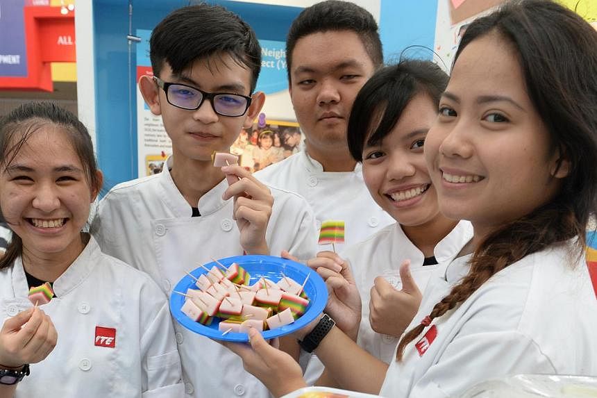 (From Left) ITE West students Lim Yi Cin, Poh Zen Feng, Nelson Yeo, Hidayu Salim and Nazirah Arianie, all aged 18. They organised a baking class at Chua Chu Kang Community Club and taught about a hundred residents how to make traditional bites such a