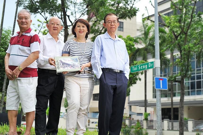 Among the contributors to the book Once Upon A Tai Seng Village are (from left) Mr Ang Mia Chaw, 73, Mr Alec Ang, 70, Ms Ann Phua, 64 - who is also the book's co-author - and Dr Stephen Chee, 78. -- PHOTO: LIM YAOHUI FOR THE STRAITS TIMES