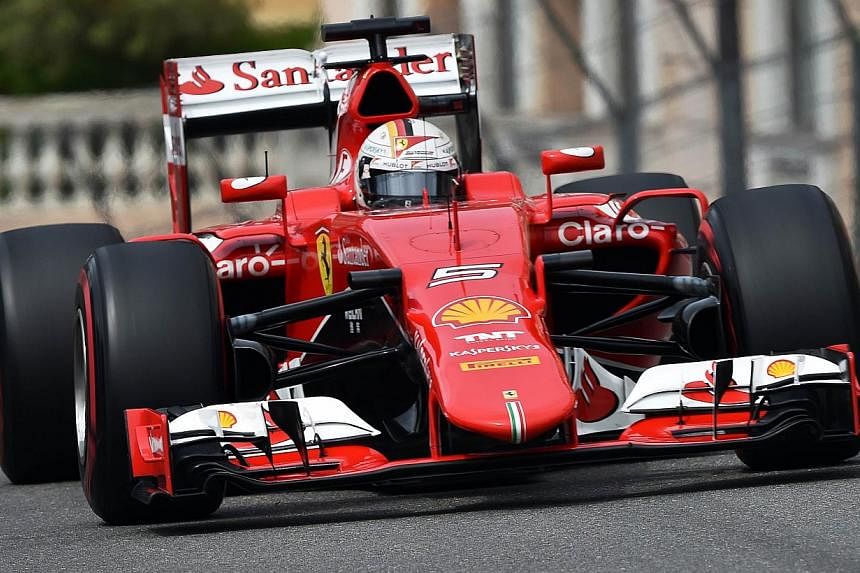 Scuderia Ferrari's German driver Sebastian Vettel drives during the third practice session at the Monaco street circuit in Monte-Carlo on May 23, 2015. -- PHOTO: AFP