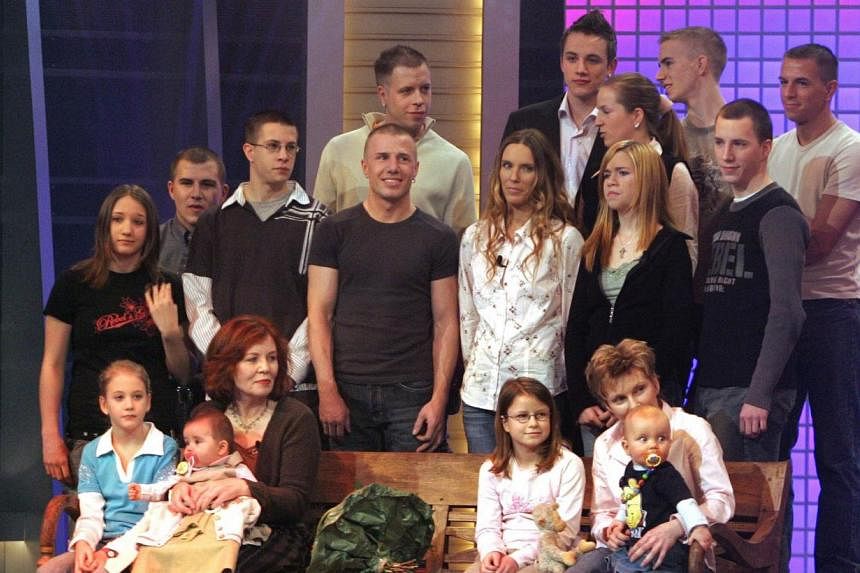 Annegret Raunigk (second from left in the first row), then 55, with her youngest daughter Lelia (on her knees) and other children and grandchildren as a guest on a German channel RTL show in Cologne in December 2005. -- PHOTO: AFP&nbsp;