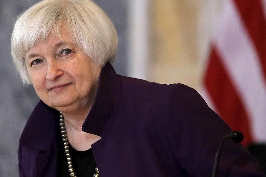 Janet Yellen (above) said Friday she expects the Federal Reserve to begin raising interest rates "at some point this year," saying delaying the long-awaited move risks the economy overheating. -- PHOTO: REUTERS