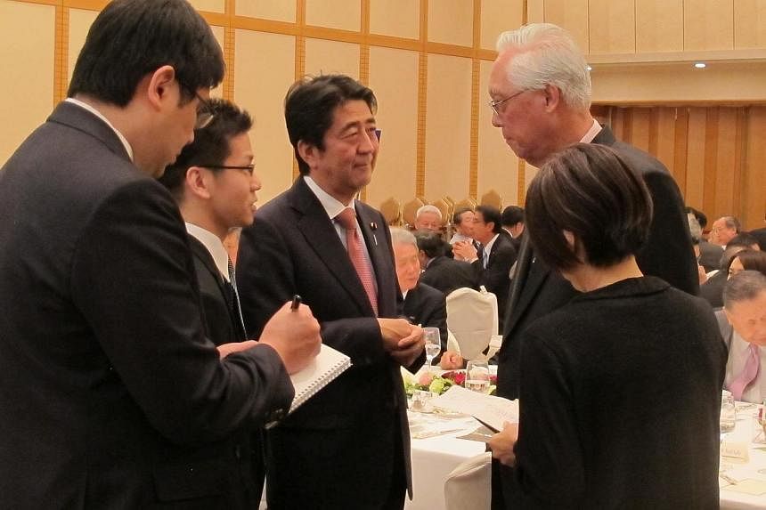 Emeritus Senior Minister Goh Chok Tong met Japan's Prime Minister Shinzo Abe (above) at a dinner for the 21st International Conference on “The Future of Asia” in Tokyo, where they exchanged views on regional developments. - PHOTO: MFA