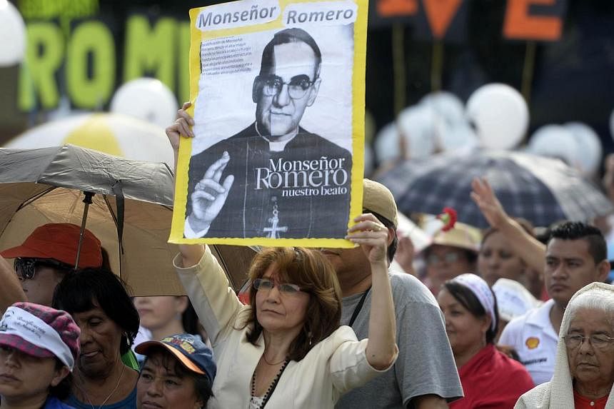 Thousands of Catholic faithful from various nationalities participate in the ceremony celebrating the beatification of martyr archbishop Oscar Romero at Las Americas square in San Salvador, on May 23, 2015. -- PHOTO: AFP
