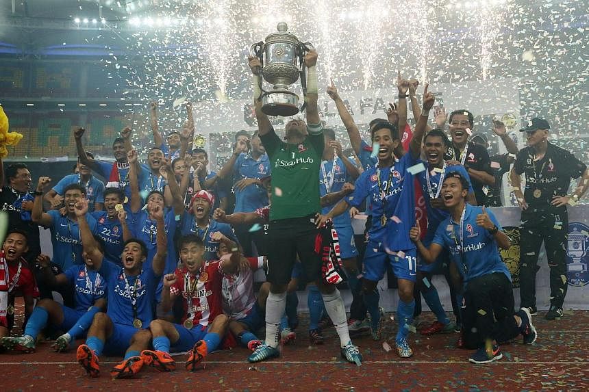 The LionsXII celebrating their Malaysia FA Cup victory after they defeated Kelantan 3-1 at the Bukit Jalil Stadium on Saturday night. -- ST PHOTO: NEO XIAOBIN&nbsp;