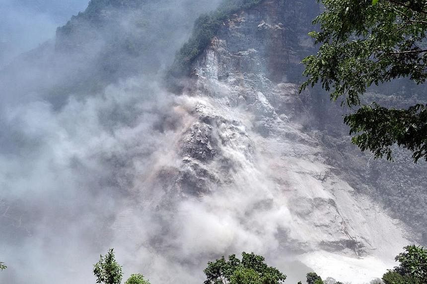 A handout photograph released by the Nepal Army on Sunday, May 24, 2015, shows an area in Nepal's mountainous north-west Myagdi district affected by a landslide.&nbsp;A river dammed up by the landslide has begun flowing again, but the risks of flash 