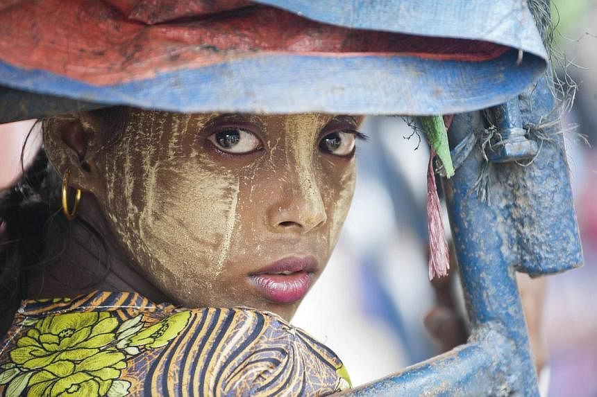 Myanmar has enacted a population law that rights groups said on Sunday targets persecuted Rohingya Muslims, a minority group at the centre of a migration crisis that has seen thousands flee the country. -- PHOTO: AFP