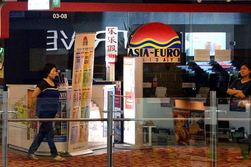 The Singapore Tourism Board (STB) has revoked the licence of tour agency Asia-Euro Holidays in Chinatown Point following its sudden closure. -- PHOTO: SHIN MIN DAILY NEWS