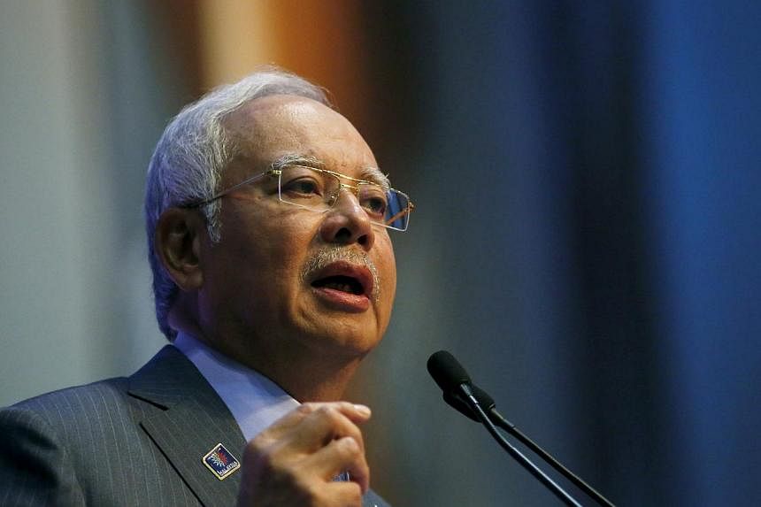 Prime Minister Datuk Seri Najib Razak has made his stand clear - he will not quit just because one person has demanded so. -- PHOTO: REUTERS