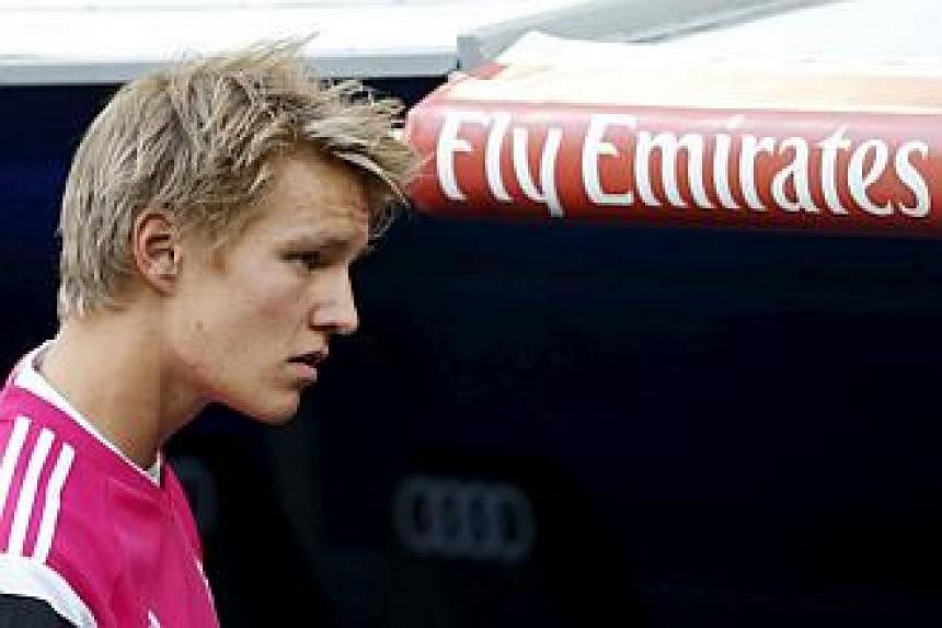 Real Madrid's Martin Odegaard walks to the bench before their match against Getafe at Santiago Bernabeu stadium in Madrid, Spain, May 23, 2015. -- PHOTO: REUTERS