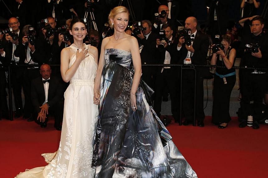Australian actress Cate Blanchett (right) and US actress Rooney Mara (left) leave the screening of 'Carol' during the 68th annual Cannes Film Festival, in Cannes, France, on May 17, 2015. -- PHOTO: EPA