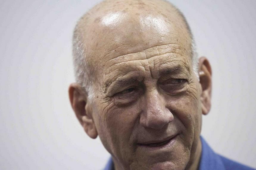 Former Israeli Prime Minister Ehud Olmert appears in Jerusalem District Court on May 25,2015.&nbsp;Former Israeli prime minister Ehud Olmert was sentenced on Monday to eight months' jail for accepting illegal payments from a United States businessman