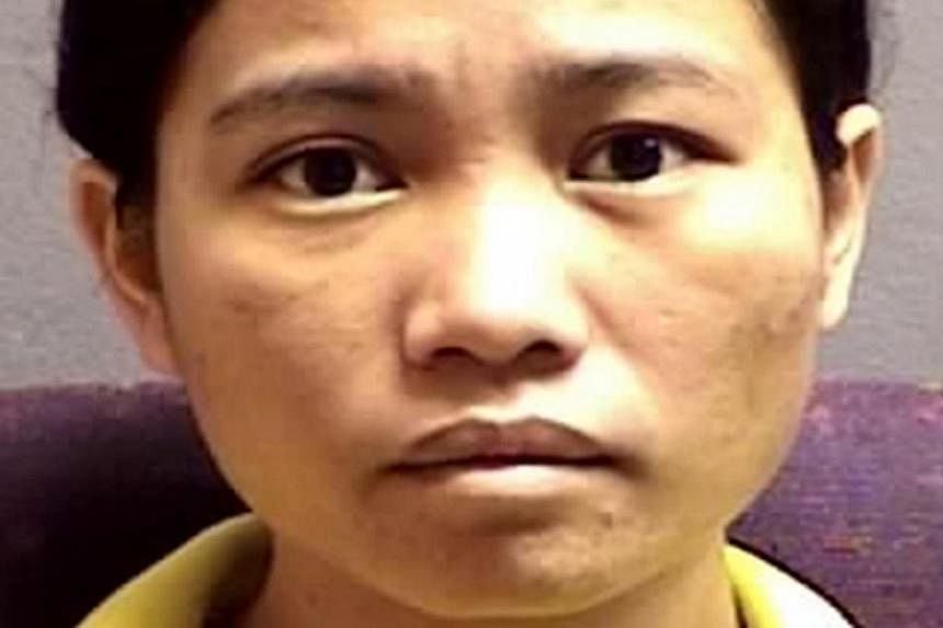 Indonesian Tuti Aeliyah, 30, was jailed 12 years for killing 16-year-old student Shameera Basha on Nov 14, 2013. -- PHOTO: SINGAPORE POLICE FORCE