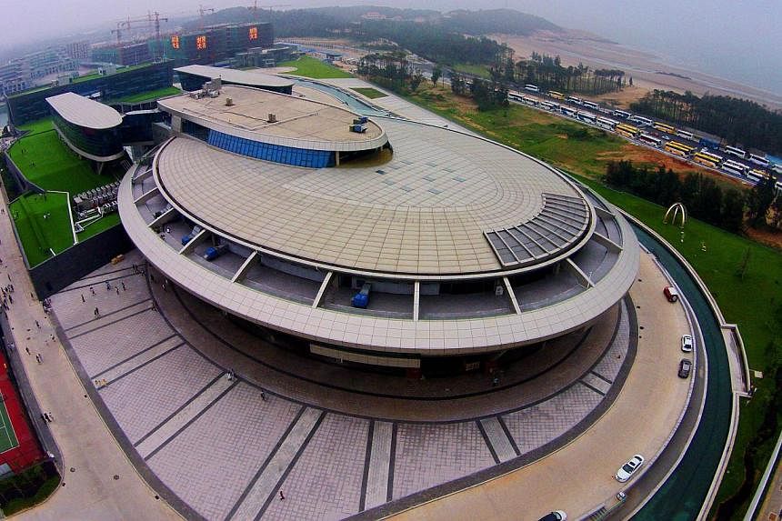 A Chinese millionaire and self-confessed Star Trek fan has boldly gone where no man has gone before with the design of his company headquarters, erected in the shape of the show's spaceship.&nbsp;-- PHOTO: AFP