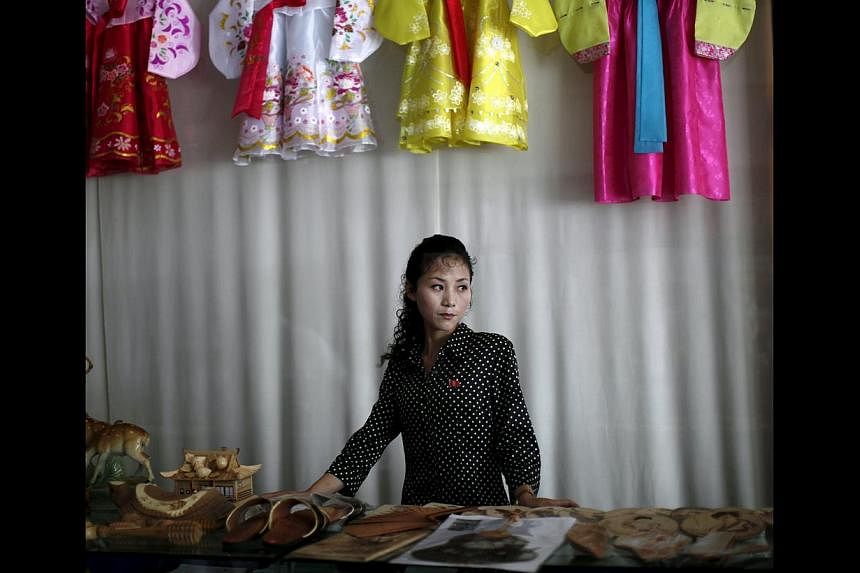 A woman manning a gift shop in Rason city, part of the special economic zone north-east of Pyongyang. North Korea may be a male-dominated society, but it is women who are making the money. They earn more than 70 per cent of household income in North 