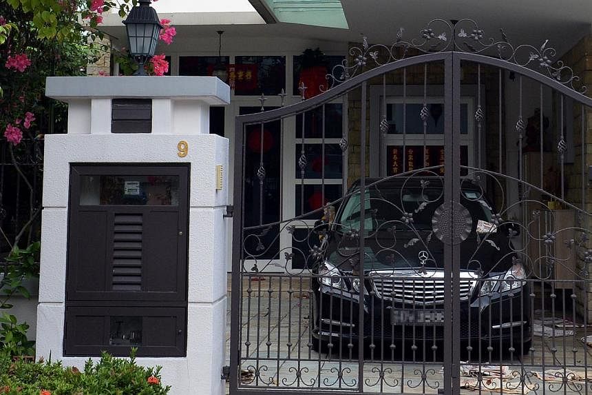 A Mercedes-Benz and a BMW were seen parked at the Tanah Merah semi-detached house of Madam Leong Lai Yee, but neighbours said they have not seen the family in two or three weeks.