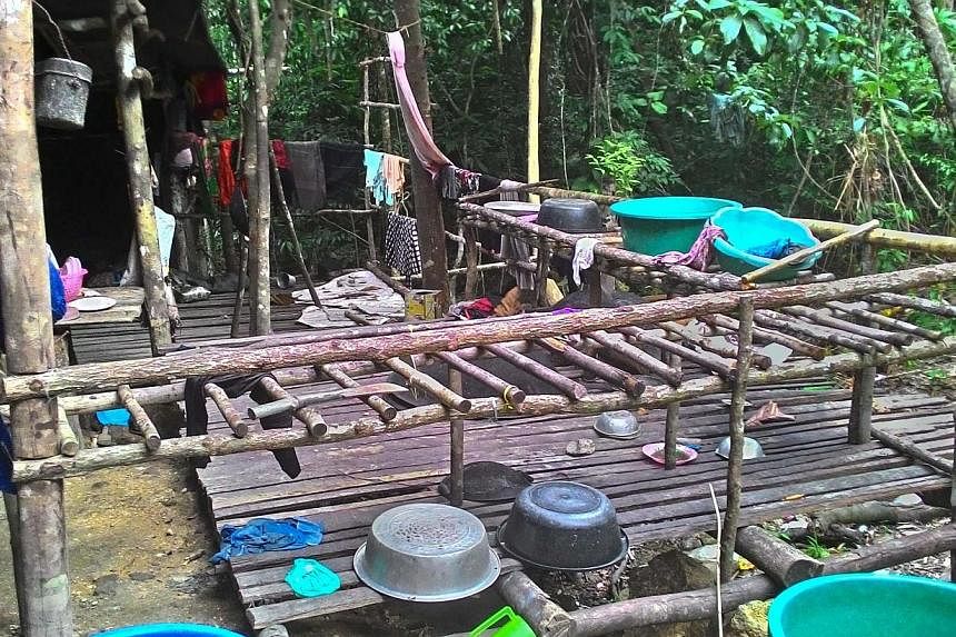 An abandoned migrant detention camp used by people smugglers in a jungle near the Malaysia-Thailand border. From May 11 to last Saturday, police personnel searched an area spanning 49.5km.