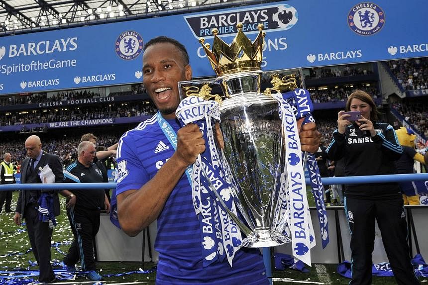Chelsea's Didier Drogba celebrates with the trophy after winning the Barclays Premier League. -- PHOTO: REUTERS&nbsp;