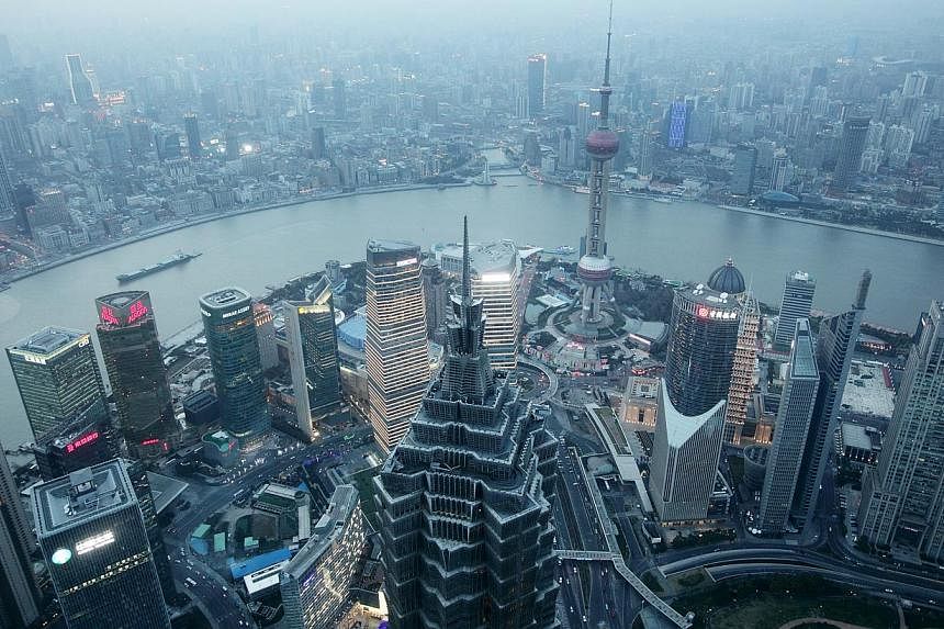 Commerical buildings in the Pudong area of Shanghai, China. Asians surpassed Europeans, but fell behind Americans in the self-made billionaires' 2015 list released by UBS and PwC on Tuesday. -- PHOTO: BLOOMBERG&nbsp;