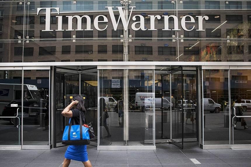 John Malone's Charter Communications struck a US$56 billion (S$75.1 billion) deal to buy Time Warner Cable, seeking to combine the third and second largest US cable operators to better compete against market leader Comcast. -- PHOTO: AFP