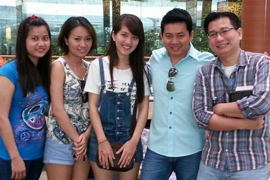 Tourist Pham Van Thoai (second from right), his girlfriend and Mr Gabriel Kang, who raised more than $15,500 online last November. -- PHOTO: GABRIEL KANG