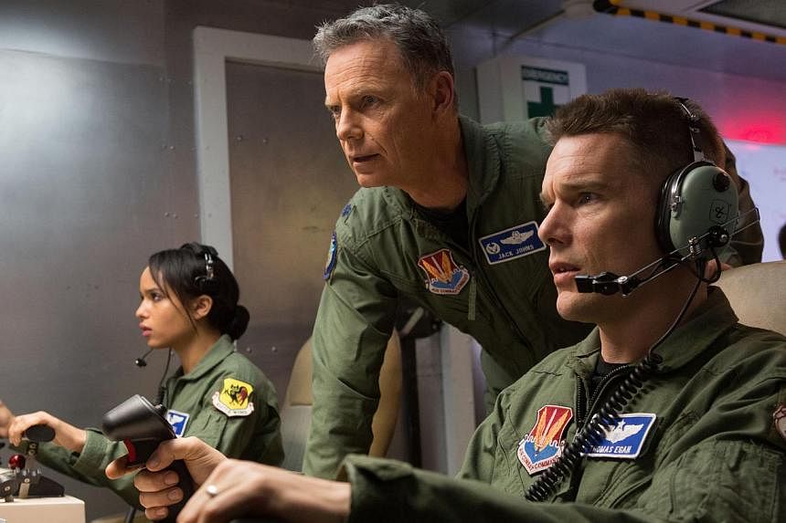 Ethan Hawke (left) as the former combat pilot who now conducts drone strikes from a safe and remote location. Also starring Zoe Kravitz (far left) and Bruce Greenwood (centre).